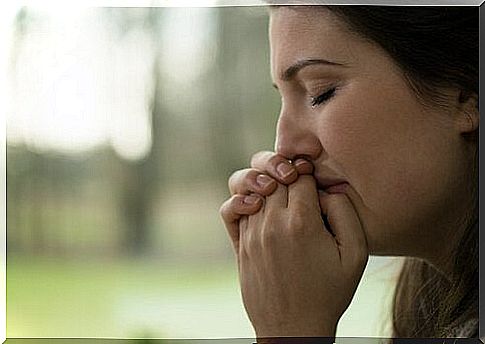 Woman crying to relieve heartbreak