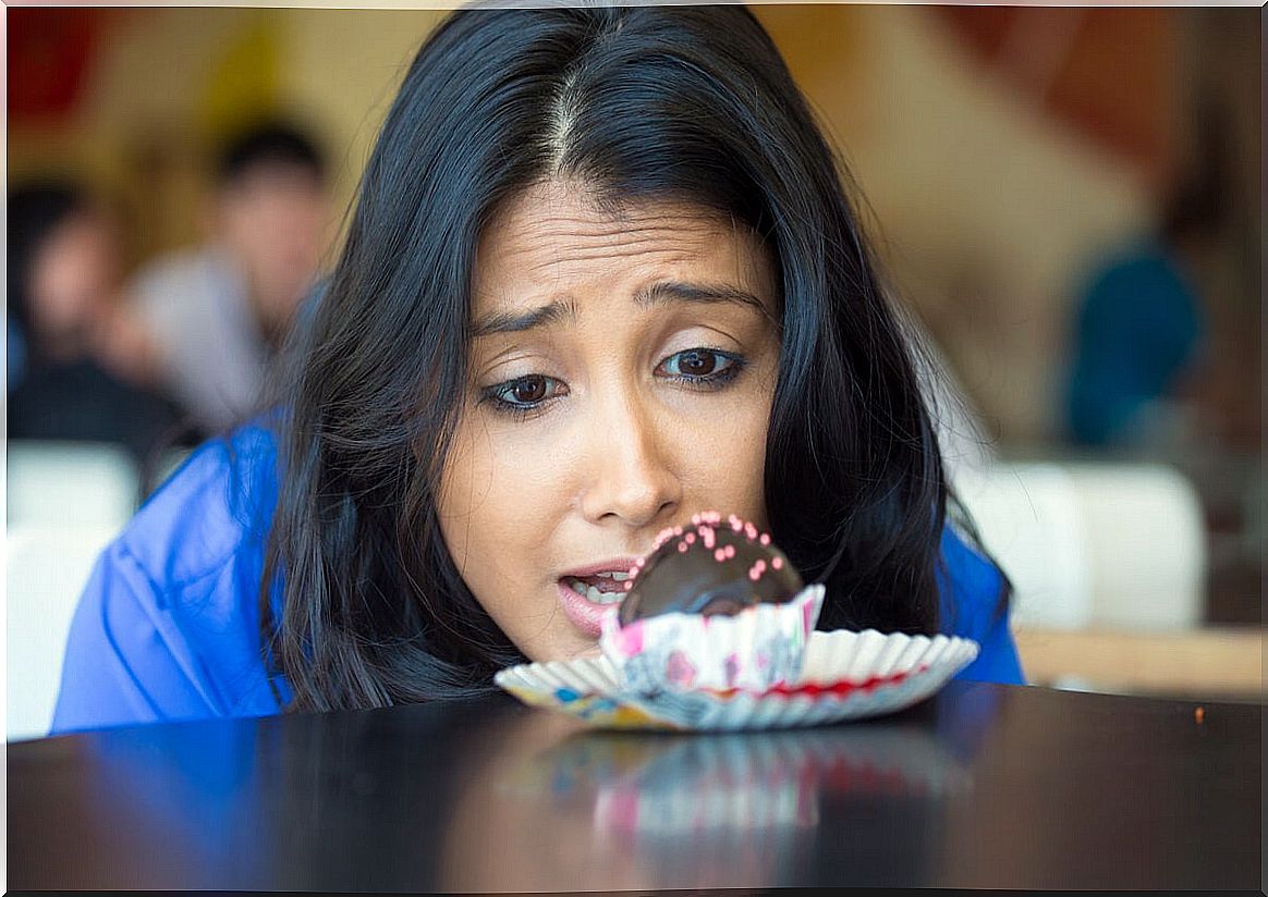 Woman wishing to eat a cake