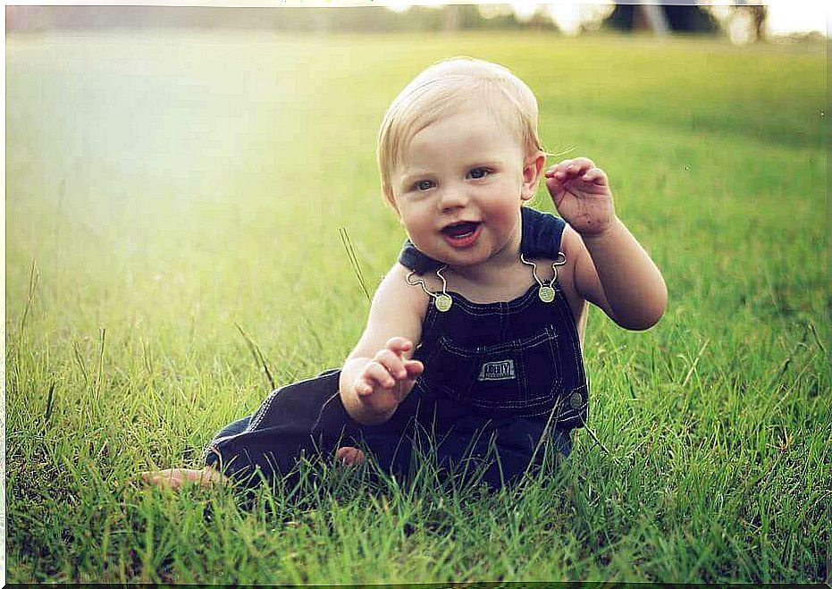 Baby playing in the field