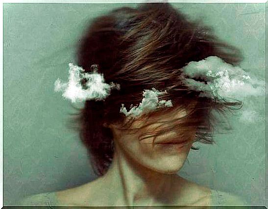 Woman with clouds around thinking about her emotional battle