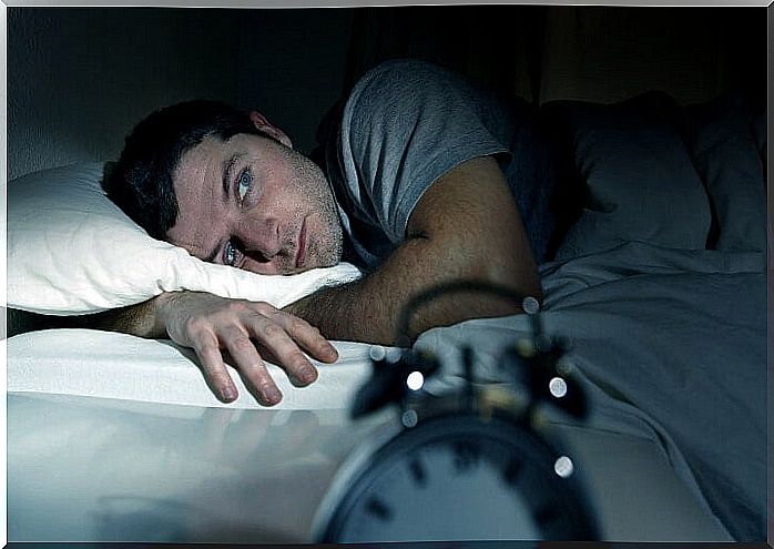 man in bed representing going to bed angry or worried