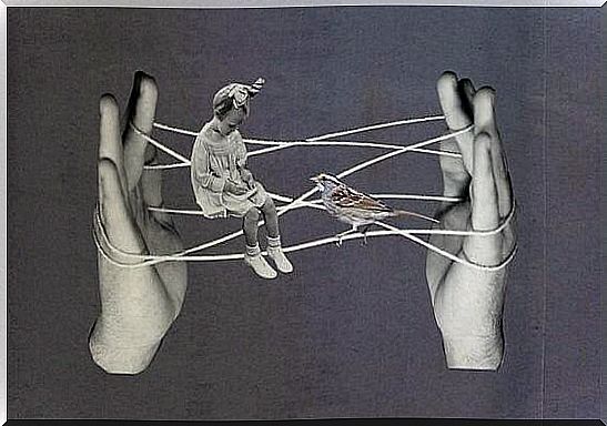 hand with strings representing trapped people