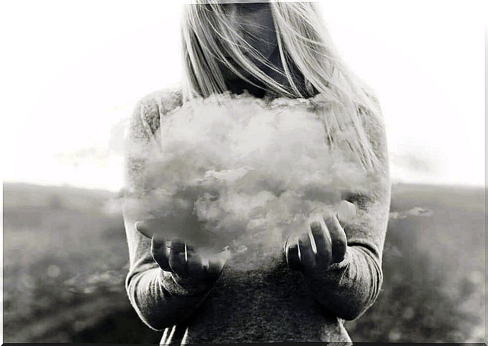 Woman holding a cloud for missing someone