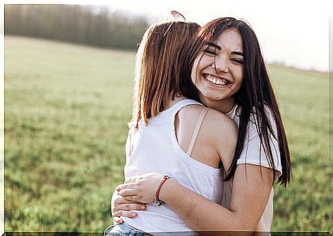 Girlfriends embraced to represent healthy friendships