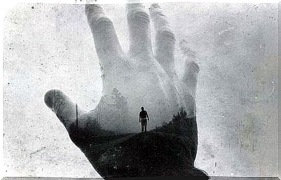 Man behind the shadow of a hand symbolizing the goal of Jungian therapy to treat anxiety