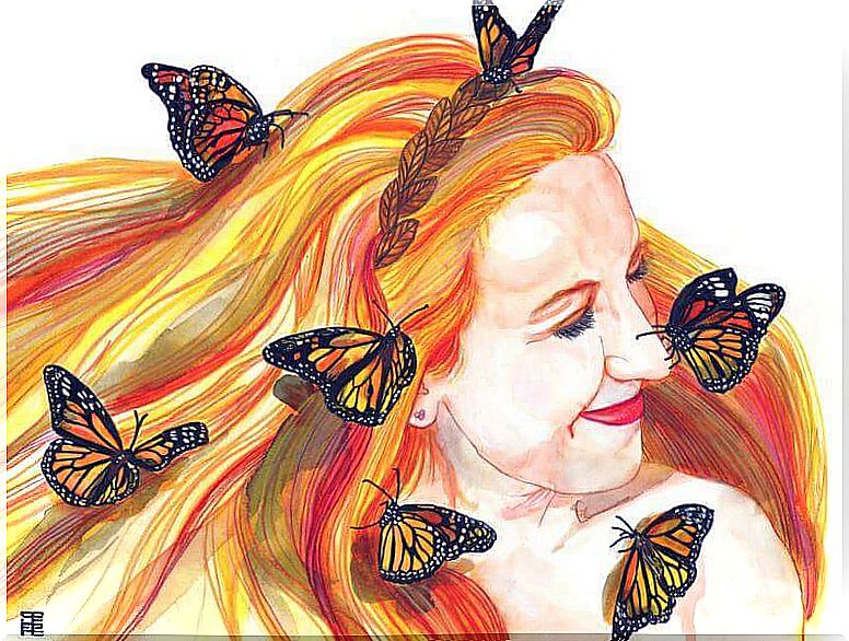 Smiling woman surrounded by butterflies