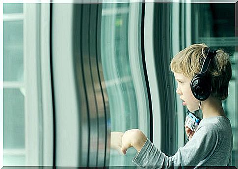 Boy with asperger's listening to music with his headphones